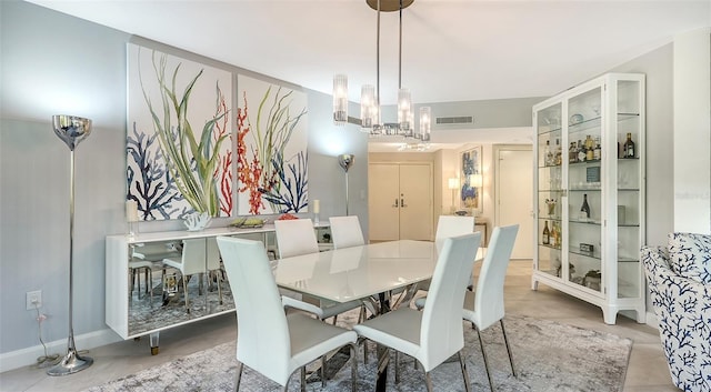 dining space featuring a notable chandelier