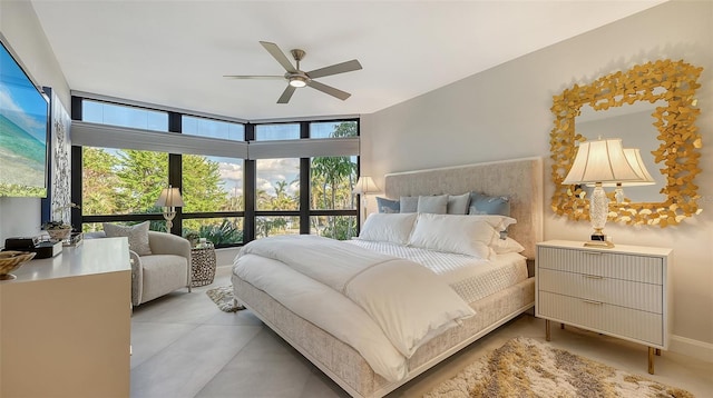 bedroom with floor to ceiling windows and ceiling fan