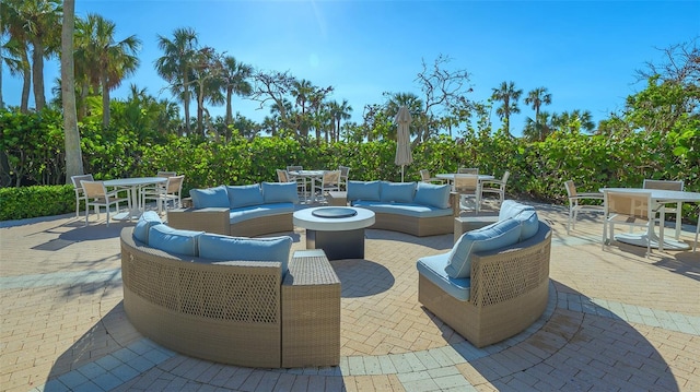 view of patio / terrace featuring an outdoor living space with a fire pit