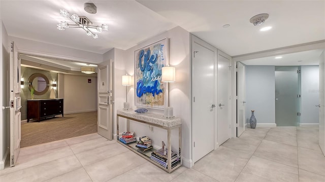 hallway with light tile patterned floors