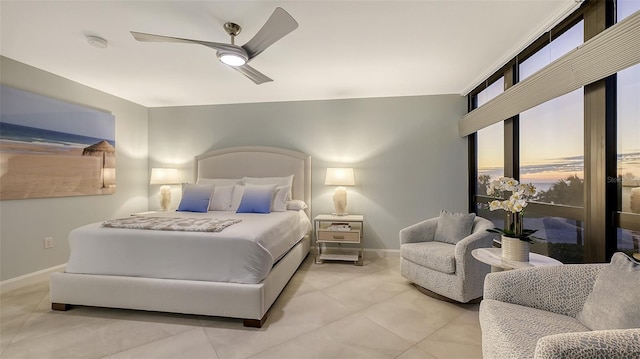 bedroom with ceiling fan and light tile patterned floors