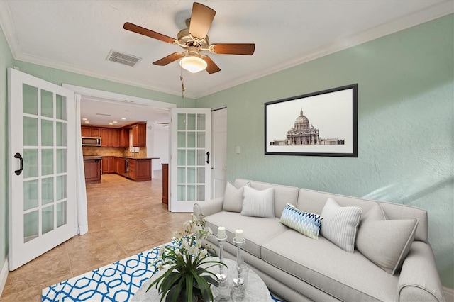 living room featuring ornamental molding, french doors, and ceiling fan