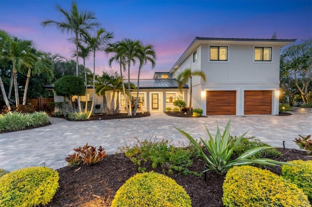 view of front of property with a garage