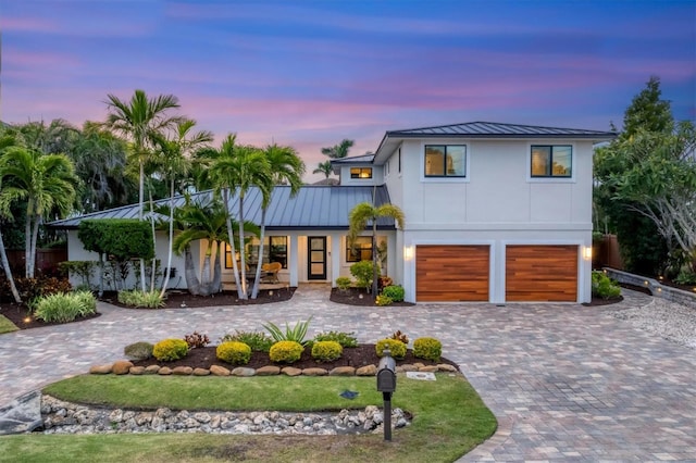 view of front of property with a garage