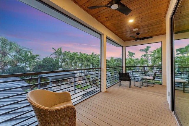 balcony at dusk with ceiling fan