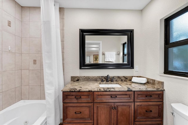 full bathroom featuring toilet, vanity, and shower / tub combo with curtain