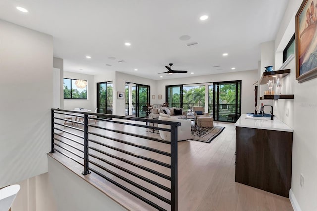 interior space with hardwood / wood-style flooring, plenty of natural light, and ceiling fan