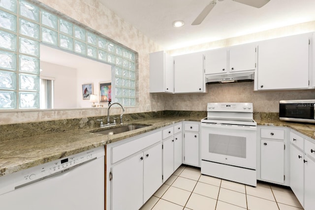 kitchen featuring sink, white appliances, and white cabinets