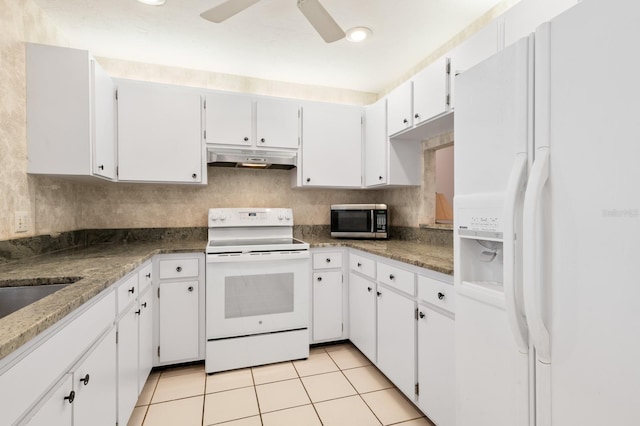 kitchen featuring light tile patterned flooring, white cabinetry, backsplash, ceiling fan, and white appliances