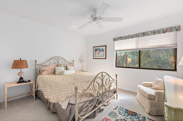 bedroom with light carpet and ceiling fan