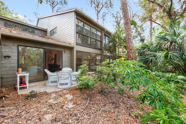 rear view of house with a patio