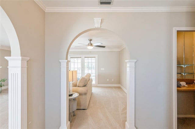 interior space with light carpet, ceiling fan, and crown molding