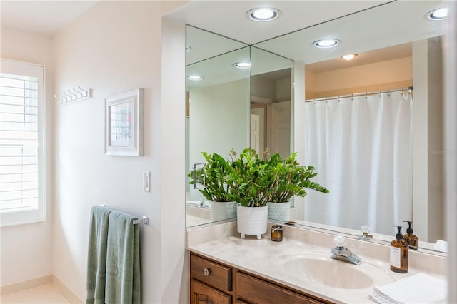 bathroom with tile patterned flooring and vanity