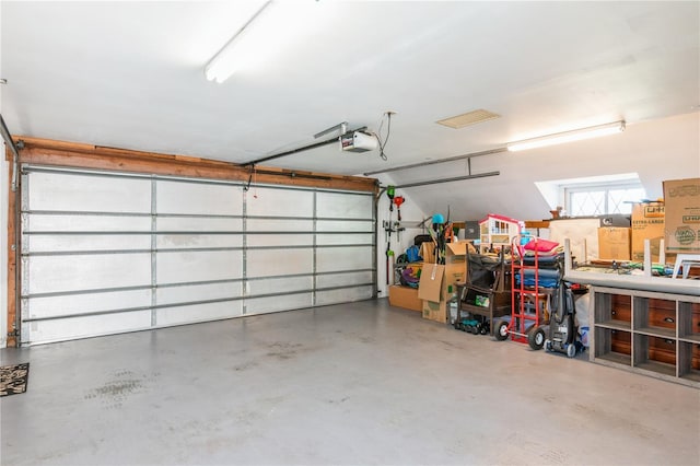 garage featuring a garage door opener