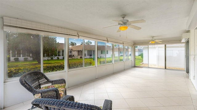 sunroom / solarium with ceiling fan