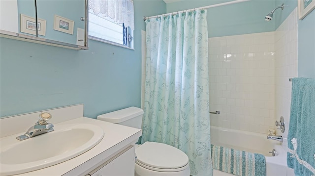 full bathroom with vanity, toilet, and shower / bath combo with shower curtain