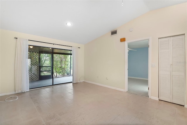 tiled spare room with ceiling fan and lofted ceiling