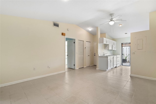 unfurnished living room with vaulted ceiling and ceiling fan