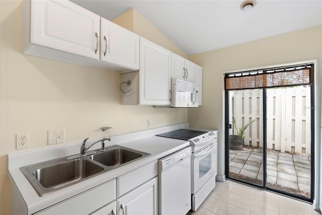 kitchen with white cabinetry, sink, and white appliances