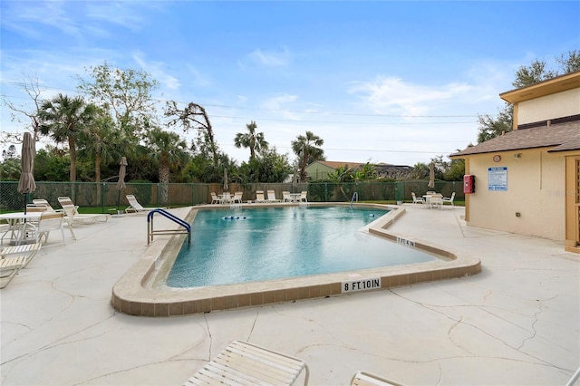 view of pool featuring a patio