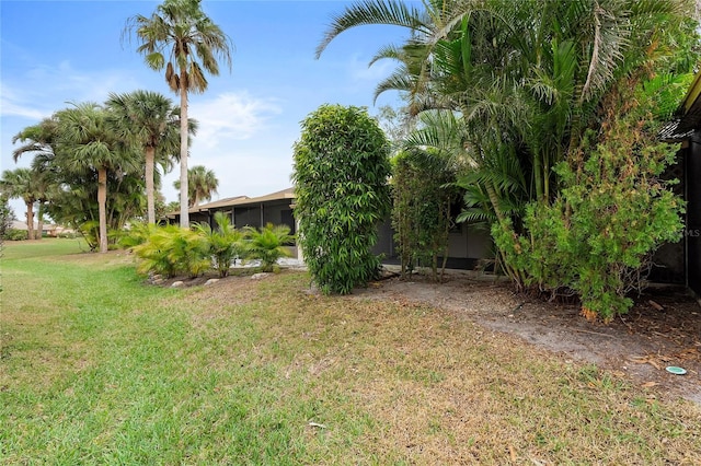 view of yard featuring a sunroom