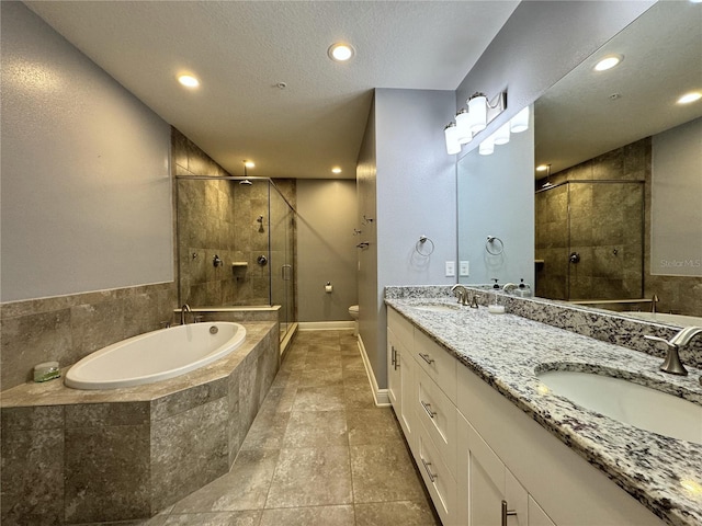 full bathroom featuring separate shower and tub, vanity, and toilet