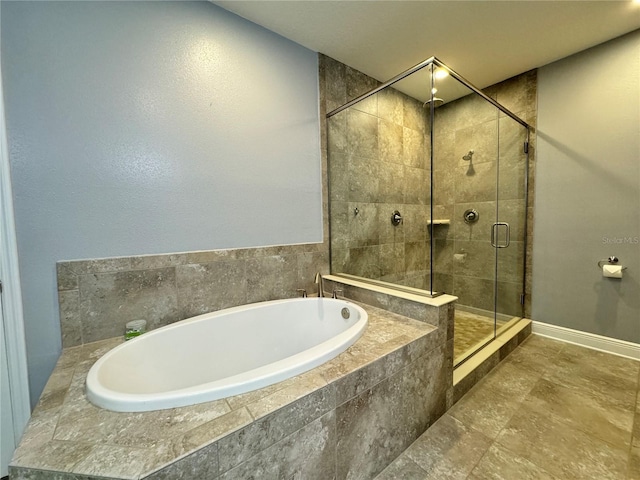 bathroom with separate shower and tub