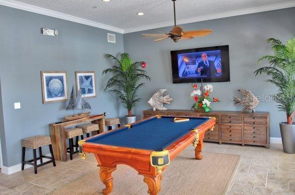 rec room featuring crown molding, ceiling fan, a textured ceiling, and pool table