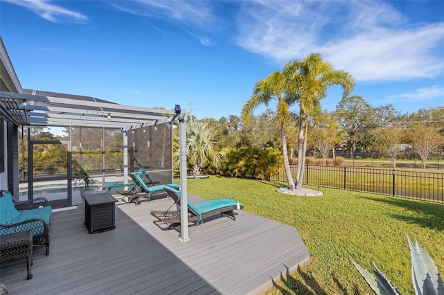 deck featuring a pergola and a lawn