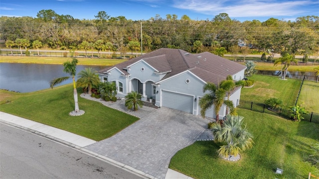 birds eye view of property featuring a water view