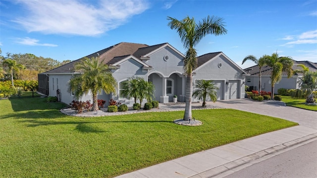 view of front of home featuring a front lawn and a garage