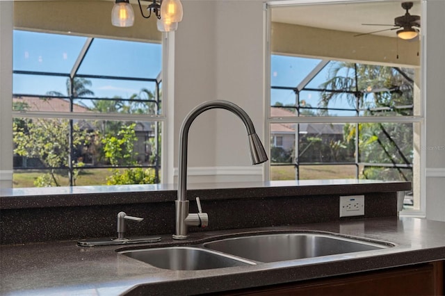 details featuring ceiling fan and sink