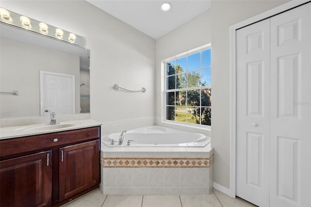 bathroom with tile patterned flooring, vanity, and separate shower and tub