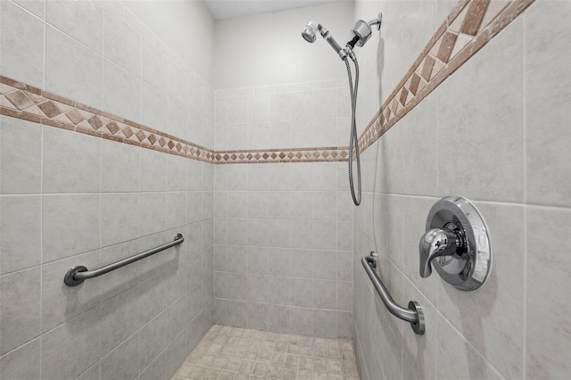 bathroom with tiled shower