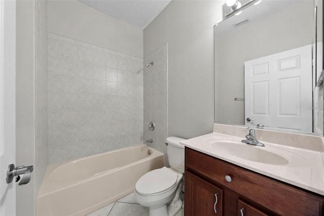 full bathroom with tile patterned floors, vanity, toilet, and tiled shower / bath