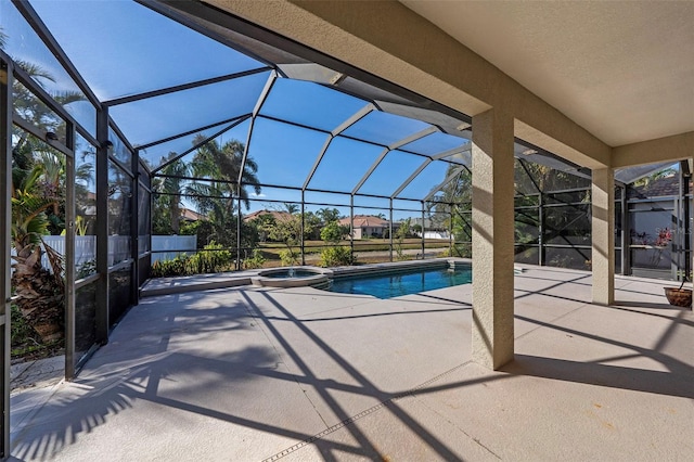 view of pool featuring a lanai, a patio, and an in ground hot tub