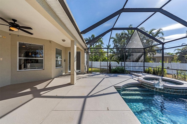 view of swimming pool featuring an in ground hot tub, a patio area, and a lanai