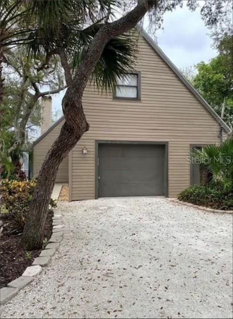 view of side of home with a garage