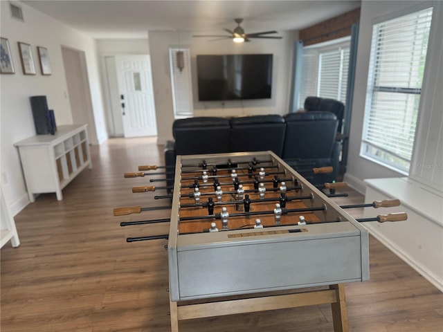 game room featuring ceiling fan and dark hardwood / wood-style flooring