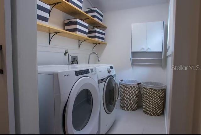 washroom with independent washer and dryer