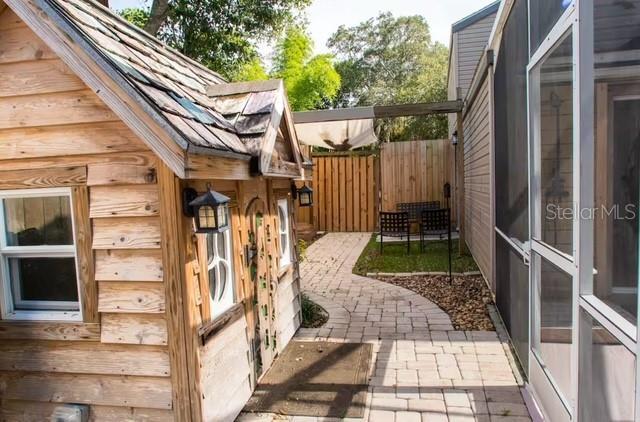 view of side of property with a patio area