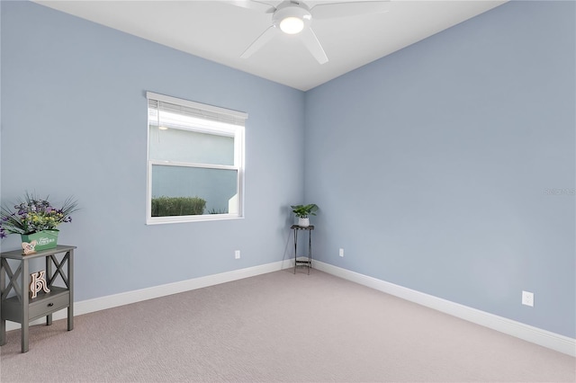 carpeted empty room featuring ceiling fan