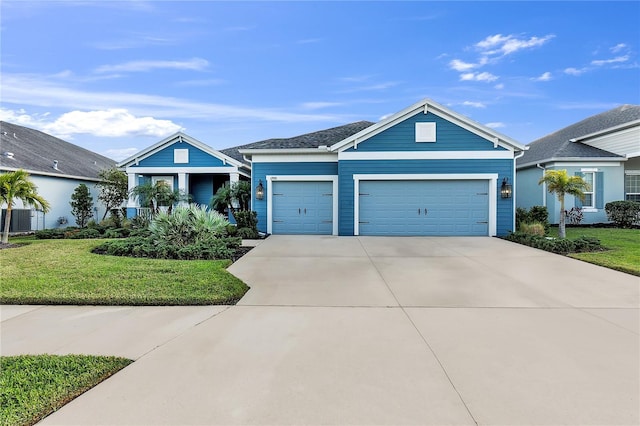 view of front of property with a garage and a front yard