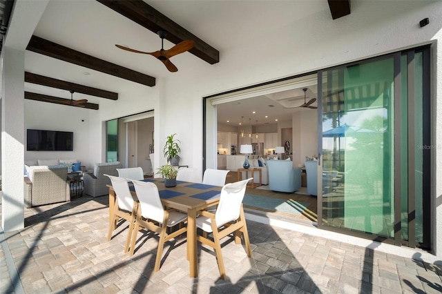 interior space with ceiling fan and beam ceiling