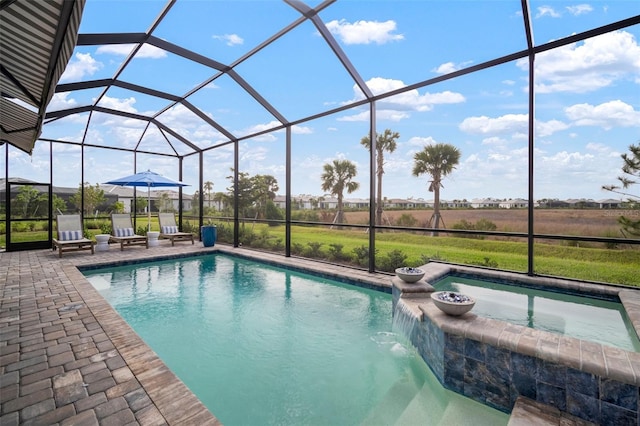 view of swimming pool with pool water feature, a lanai, an in ground hot tub, a rural view, and a patio area