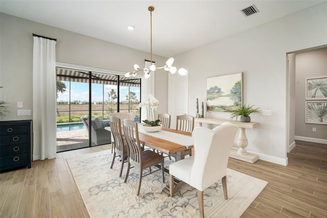 dining space featuring a chandelier