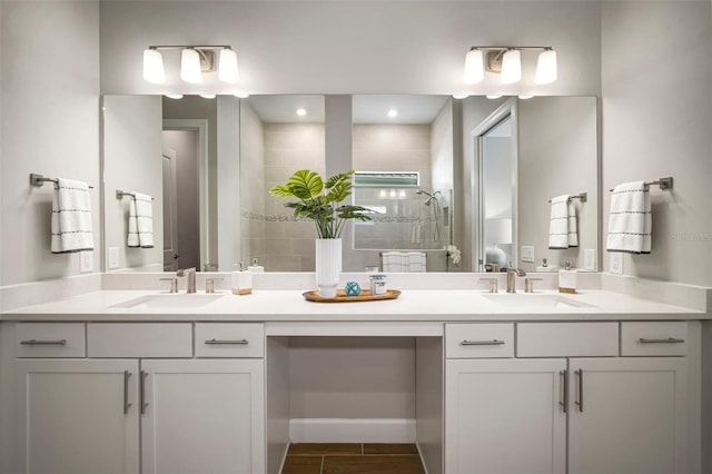 bathroom featuring vanity and an enclosed shower