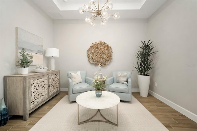 sitting room featuring a chandelier