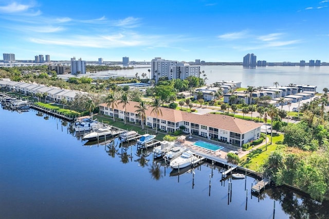 birds eye view of property with a water view