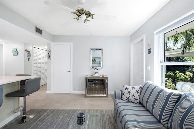 living room featuring ceiling fan